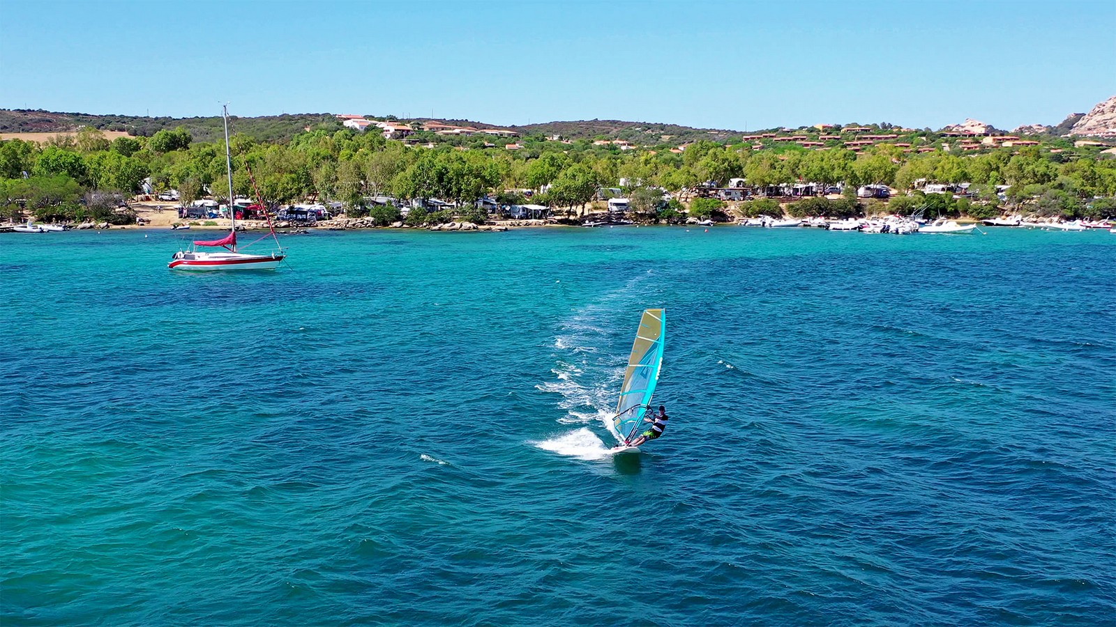 Crystal clear water and good steady wind : a windsurfer&apos;s paradise